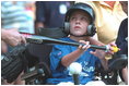 Decked out in T-shirts proclaiming themselves as either ""South Lawn Sluggers"" or ""South Lawn Buddies,"" about two dozen little leaguers played tee-ball on the White House South Lawn Sunday July 15, 2001.