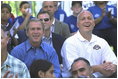 President George W. Bush and Commissioner Cal Ripken watch the game with team families Sunday, May 5, 2002. In addition to moms and dads, Arizona Diamondback Erubiel Durazo, and Major League Baseball Hall of Famers Tony Perez and Orlando Cepeda came to root for the two teams.