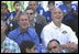 President George W. Bush and Commissioner Cal Ripken watch the game with team families Sunday, May 5, 2002. In addition to moms and dads, Arizona Diamondback Erubiel Durazo, and Major League Baseball Hall of Famers Tony Perez and Orlando Cepeda came to root for the two teams.