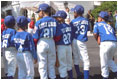 Standing outside of the South Portico, the Uniondale Little League Sluggers gather together before walking to the field. Prior to the game, the two teams and their guests toured the White House Sunday, May 5, 2002.