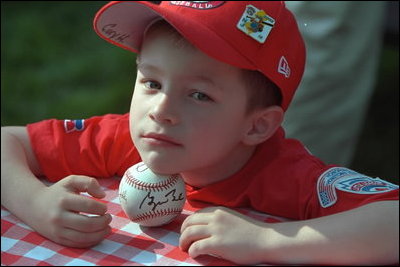 Each player received a baseball signed by President Bush and Commissioner Ripken. By the end of the day, many of the souvenir balls had been taken out of their stately Navy blue boxes and were marked with grass stains received from playing catch Sunday, May 5, 2002.