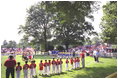 President George W. Bush attends a Tee Ball on the South Lawn game between the Cardinals and the South Berkeley Little League Braves from Inwood, West Virginia. June 23, 2002.