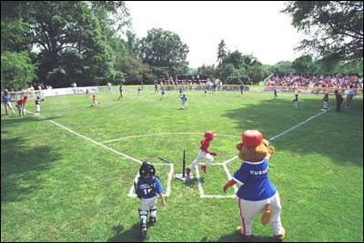 President George W. Bush attends a Tee Ball on the South Lawn game between the Cardinals and the South Berkeley Little League Braves from Inwood, West Virginia. June 23, 2002.