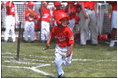 President George W. Bush attends a Tee Ball on the South Lawn game between the Cardinals and the South Berkeley Little League Braves from Inwood, West Virginia. June 23, 2002.