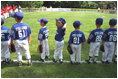 President Bush attends a Tee Ball on the South Lawn game between the Cardinals and the South Berkeley Little League Braves from Inwood, West Virginia, June 23, 2002.