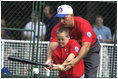 President George W. Bush hosts a White House Tee Ball (t-ball) game on the South Lawn between the Waynesboro, Virginia Little League Challenger Division Sand Gnats (Blue Team) vs. the East Brunswick, New Jersey Babe Ruth Buddy Ball League Sluggers (Red Team) September 22, 2002.