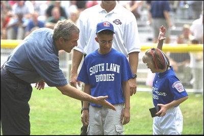 President George W. Bush hosts a White House Tee Ball (t-ball) game on the South Lawn between the Waynesboro, Virginia Little League Challenger Division Sand Gnats (Blue Team) vs. the East Brunswick, New Jersey Babe Ruth Buddy Ball League Sluggers (Red Team) September 22, 2002.