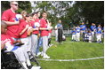 President George W. Bush hosts a White House Tee Ball (t-ball) game on the South Lawn between the Waynesboro, Virginia Little League Challenger Division Sand Gnats (Blue Team) vs. the East Brunswick, New Jersey Babe Ruth Buddy Ball League Sluggers (Red Team) September 22, 2002.