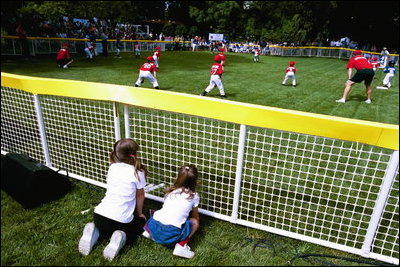 President George W. Bush and Mrs. Bush hosts Tee Ball on the South Lawn with The Fort Belvoir Little League Braves of Fort Belvoir, Virginia and the Naval Base Little League Yankees of Norfolk, Virginia, June 23, 2003.