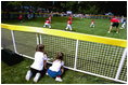 President George W. Bush and Mrs. Bush hosts Tee Ball on the South Lawn with The Fort Belvoir Little League Braves of Fort Belvoir, Virginia and the Naval Base Little League Yankees of Norfolk, Virginia, June 23, 2003.