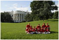 President George W. Bush and Mrs. Bush hosts Tee Ball on the South Lawn with The Fort Belvoir Little League Braves of Fort Belvoir, Virginia and the Naval Base Little League Yankees of Norfolk, Virginia, June 23, 2003.