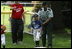 President George W. Bush and Mrs. Bush hosts Tee Ball on the South Lawn with The Fort Belvoir Little League Braves of Fort Belvoir, Virginia and the Naval Base Little League Yankees of Norfolk, Virginia, June 23, 2003.