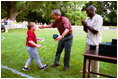 President George W. Bush hosts Tee Ball on the South Lawn with The Oriole Advocates Challengers of Marley Area Little League of Glen Burnie, Maryland and The Ridley Police Challengers of Leedom Little League, Ridley Park, Pennsylvania, July 27, 2003.