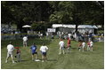 President George W. Bush hosts Tee Ball on the South Lawn with The Oriole Advocates Challengers of Marley Area Little League of Glen Burnie, Maryland and The Ridley Police Challengers of Leedom Little League, Ridley Park, Pennsylvania, July 27, 2003.