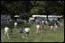 President George W. Bush hosts Tee Ball on the South Lawn with The Oriole Advocates Challengers of Marley Area Little League of Glen Burnie, Maryland and The Ridley Police Challengers of Leedom Little League, Ridley Park, Pennsylvania, July 27, 2003.