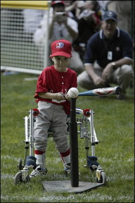 President George W. Bush hosts Tee Ball on the South Lawn with The Oriole Advocates Challengers of Marley Area Little League of Glen Burnie, Maryland and The Ridley Police Challengers of Leedom Little League, Ridley Park, Pennsylvania, July 27, 2003.