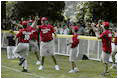 President George W. Bush hosts Tee Ball on the South Lawn with The Oriole Advocates Challengers of Marley Area Little League of Glen Burnie, Maryland and The Ridley Police Challengers of Leedom Little League, Ridley Park, Pennsylvania, July 27, 2003.