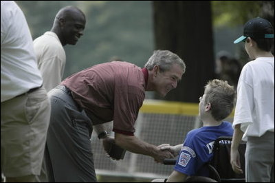 President George W. Bush hosts Tee Ball on the South Lawn with The Oriole Advocates Challengers of Marley Area Little League of Glen Burnie, Maryland and The Ridley Police Challengers of Leedom Little League, Ridley Park, Pennsylvania, July 27, 2003.