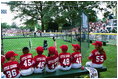 A Devil Dog cheers as a teammate rounds first base during the first game of the 2004 White House Tee Ball season June 13, 2004.