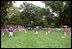 A little league Cardinal flies to second base during the first game of the 2004 White House Tee Ball season June 13, 2004. The Bolling Air Force Base Little League Cardinals and the Cherry Point Marine Corps Air Station Devil Dogs met on the field for a decisive battle, in which both teams earned signed baseballs from the President and hotdogs.