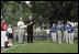 President George W. Bush stands with Cal Ripken Jr. for the National Anthem at Tee Ball on the South Lawn at the White House on Sunday July 11, 2004.