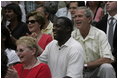 President George W. Bush and First Lady Laura Bush watch the Challenger Phillies of M.O.T. Little League from Middletown, Delaware take on the Challenger Yankees of Lancaster County Little Leagues from Lancaster County, Pennsylvania at Tee Ball on the South Lawn at the White House on Sunday July 11, 2004.