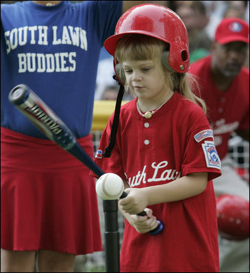 A player from the West University Little League Challengers from Houston, Texas, prepares to hit the ball, Sunday, July 24, 2005, during a Tee Ball game on the South Lawn of the White House.