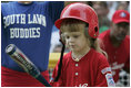 A player from the West University Little League Challengers from Houston, Texas, prepares to hit the ball, Sunday, July 24, 2005, during a Tee Ball game on the South Lawn of the White House.