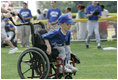 A young ballplayer from the District 12 Little League Challengers  of Williamsport, Pa., works the outfield Sunday, July 24, 2005, at a Tee Ball game on the South Lawn of the White House.