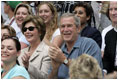 President George W. Bush and Mrs. Laura Bush cheers on players during a Tee Ball game on the South Lawn of the White House between the District 12 Little League Challengers from Williamsport, PA and the West University Little League Challengers from Houston, Texas on Sunday July 24, 2005.