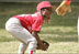 Taylor Paige Nevils of South Side Little League Memphis Red Sox from Chicago, peers up at Dugout, the Little League mascot, during a T-ball game on the South Lawn Sunday, June 26, 2005.