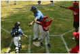 Everyone's on the move as the Memphis Red Sox from Chicago score against the Black Yankees of Newark during "Tee Ball on the South Lawn" Sunday, June 26, 2005.