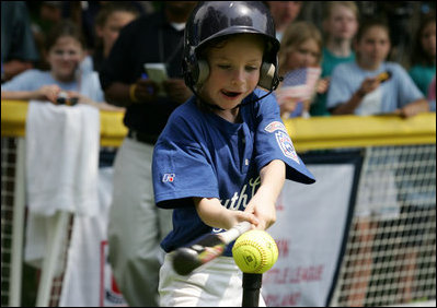 The tongue is out as the swing is swung during an at bats for a Bobcat from Cumberland, Maryland Wednesday, June 27, 2007, against the Luray, Virginia Red Wings on the South Lawn. The game marked the opening of the 2007 White House Tee Ball season.