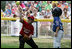 It's safe at first for a Cumberland Bobcat as the Red Wings' first baseman returns the ball to the catcher Wednesday, June 27, 2007, during the first game of the 2007 White House Tee Ball season on the South Lawn. The game pitted the Luray, Virginia team against the Cumberland, Maryland kids, and marked the seventh year of the President's White House Tee Ball Initiative.