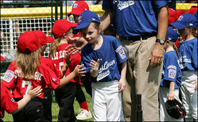 High-fives abound between the Luray, Virginia Bobcats and the Cumberland, Maryland Red Wings after the opening game of the 2007 White House Tee Ball season Wednesday, June 27, 2007, on the South Lawn. 