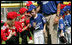 High-fives abound between the Luray, Virginia Bobcats and the Cumberland, Maryland Red Wings after the opening game of the 2007 White House Tee Ball season Wednesday, June 27, 2007, on the South Lawn. 