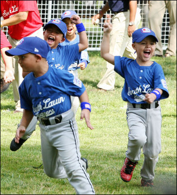 Players of the Jose M. Rodriguez Little League Angels of Manatí, Puerto Rico, jubilate at the conclusion the 2008 Tee Ball on the South Lawn Season Opener Monday, June 30, 2008, on the South Lawn of the White House.