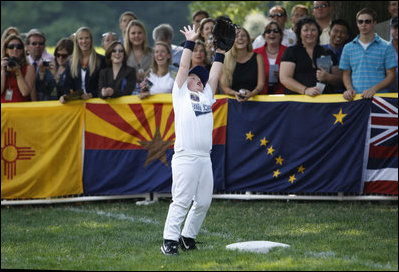  Keegan Henjum the U.S. Central All-Star first baseman, reaches high to the delight of fans Wednesday, July 16, 2008, during an All-Star Tee Ball doubleheader on the South Lawn of the White House.