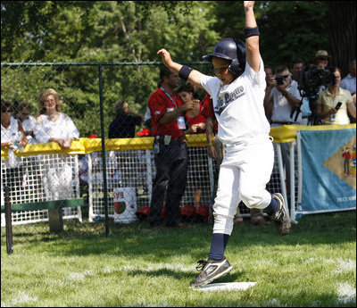  Six-year-old Tucker Tekautz of the Central U.S. All-Stars crosses home plate Wednesday, July 16, 2008, during their Tee Ball at the White House matchup against the Eastern U.S. All-Stars.