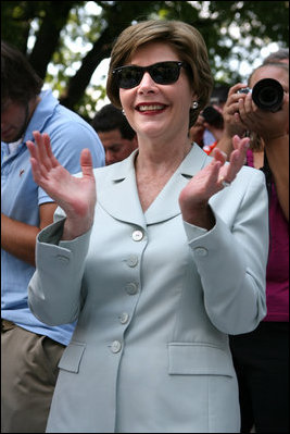  Mrs. Laura Bush shows her enthusiasm for the spirited game of tee ball as young All-Star players from across the United States gather to play on the White House South Lawn on July 16, 2008. President George W. Bush watched the game a few seats away on a bleachers set up for the event for the young players.