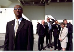 As a secret service agent stands nearby, Vice President Dick Cheney views the Port of Tampa with (from left to right) Florida Gov. Jeb Bush, Mayor Dick Greco of Tampa, Mayor Glenda Hood of Orlando, and Commissioner Tim Moore of the Florida Department of Law Enforcement for a briefing on Florida's domestic security strategy at the Port of Tampa in Tampa, Fla., Thursday, Oct. 24. The Vice President visited the port to attend Florida's Regional Domestic Security Task Force meeting.  White House photo by David Bohrer