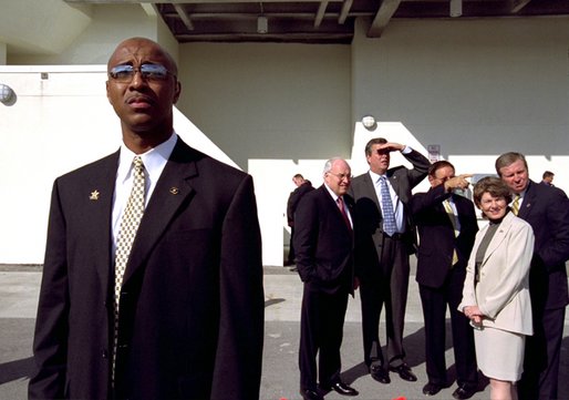 As a secret service agent stands nearby, Vice President Dick Cheney views the Port of Tampa with (from left to right) Florida Gov. Jeb Bush, Mayor Dick Greco of Tampa, Mayor Glenda Hood of Orlando, and Commissioner Tim Moore of the Florida Department of Law Enforcement for a briefing on Florida's domestic security strategy at the Port of Tampa in Tampa, Fla., Thursday, Oct. 24. The Vice President visited the port to attend Florida's Regional Domestic Security Task Force meeting. White House photo by David Bohrer.