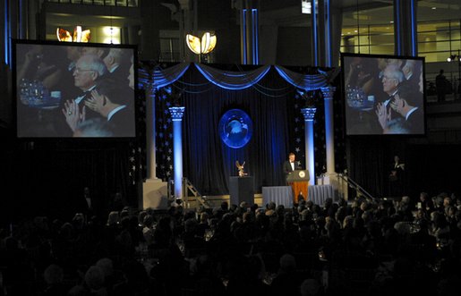 Former President George H. W. Bush accepts the American Patriot Award at the National Defense University Foundation's banquet Dec. 6, 2002. The former president received the award for his lifelong commitment to public service and leadership during the Persian Gulf War. White House photo by David Bohrer.