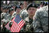 Soldiers listen as Vice President Dick Cheney delivers remarks at a rally at Fort Riley Army Base in Kansas, Tuesday, April 18, 2006. During his address the vice president recognized the 3rd Brigade Combat Team of the 24th Infantry Division by welcoming them home from their recent tour in Iraq and thanking them for their service and support during the Iraqi elections.