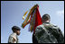 Vice President Dick Cheney participates in the awarding of the Valorous Unit Award to the First Brigade Combat Team, First Infantry Division during a rally for the troops at Fort Riley Army Base in Kansas, Tuesday, April 18, 2006.