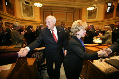 Vice President Dick Cheney and Mrs. Lynne Cheney shake hands with members of the Wyoming State Legislature as they depart the State Capitol, Friday, February 17, 2006.