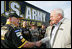 Vice President Dick Cheney meets members of the U.S. ARMY NASCAR racing team Saturday, July 1, 2006, while attending the 2006 Pepsi 400 NASCAR race at Daytona International Speedway in Daytona, Fla.