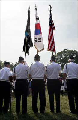 An honor guard composed of Korean War veterans holds flags prior to the start of the 2006 Korean War Veterans Armistice Day Ceremony held at the Korean War Memorial on the National Mall in Washington, D.C., Thursday, July 27, 2006.