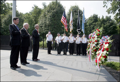 Vice President Dick Cheney stands with Secretary of the Interior Dirk Kempthorne, right, and South Korean Ambassador to the U.S. Tae Sik Lee, left, during a moment of silence after placing a wreath at the Korean War Memorial in Washington, D.C. to commemorate Korean War Veterans Armistice Day, Thursday, July 27, 2006. Today marks the 53rd anniversary of the end of the Korean War.