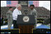 Vice President Dick Cheney administers the Ceremonial Oath of Re-enlistment of Corporal Jarrod Fields, at a rally for the troops at Fort Stewart, Ga., Friday, July 21, 2006. Cpl. Fields was wounded by an improvised explosive device in 2005 while serving in Iraq with the 3rd Infantry Division.